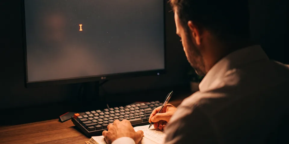 Content marketing writing what customers search for, shown as an orange text cursor lighting a desk at night Content marketing writing what customers search for, shown as an orange text cursor lighting a desk at night
