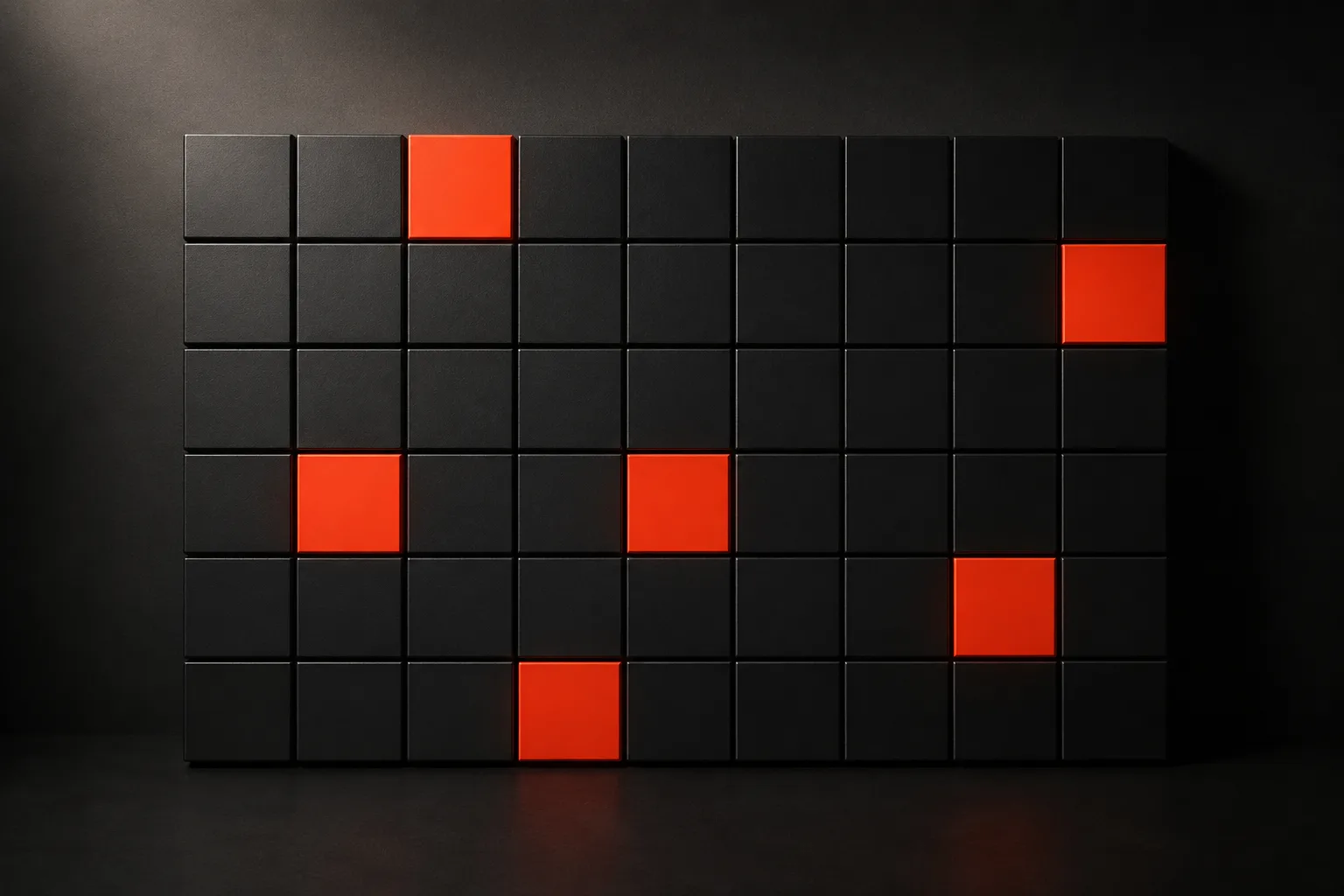 A black wall grid of identical tiles with a handful glowing solid orange in a staggered rhythm β a metaphor for social content written to a deliberate publishing cadence A black wall grid of identical tiles with a handful glowing solid orange in a staggered rhythm β a metaphor for social content written to a deliberate publishing cadence